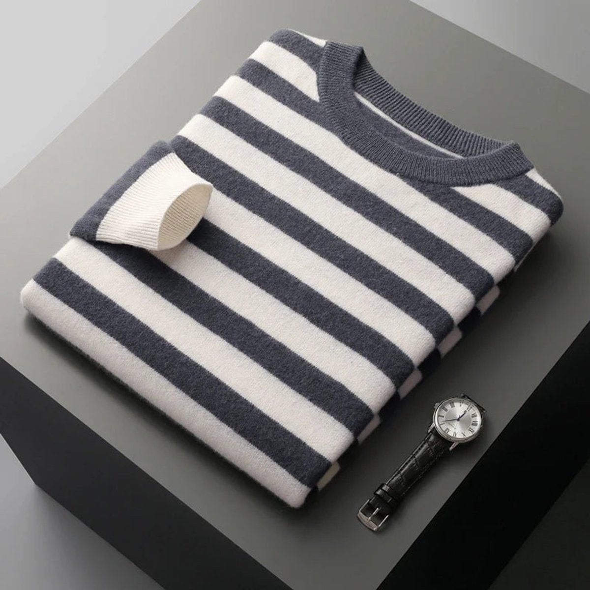 Charcoal and cream striped pullover folded with ribbed crew neckline