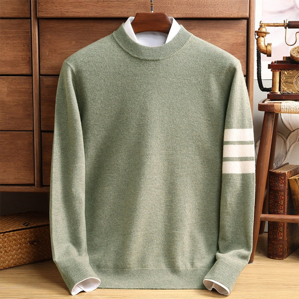 Sage green mock-neck jumper with striped sleeve detail and mock shirt collar