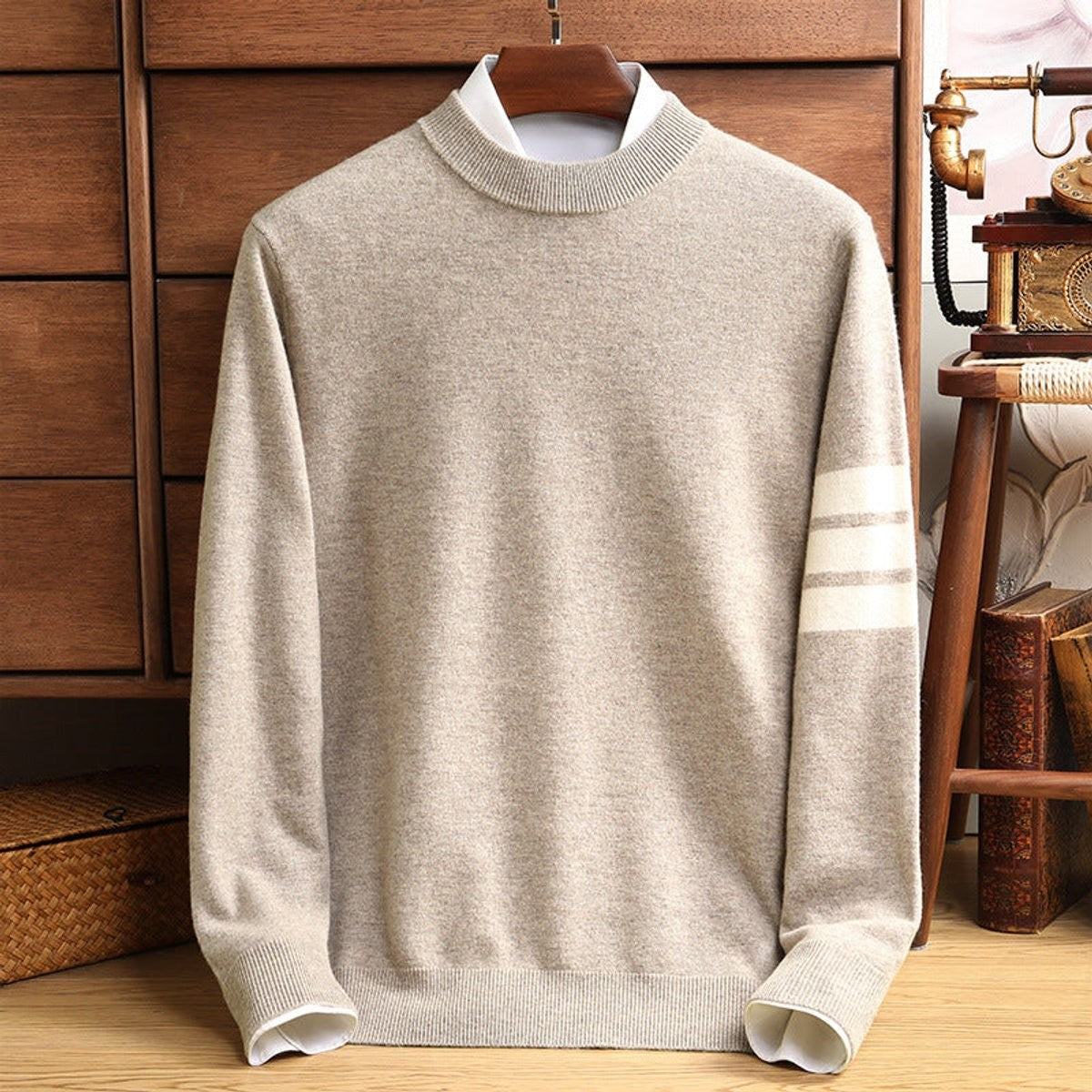 Oatmeal beige knitted jumper featuring striped sleeve and ribbed mock neckline