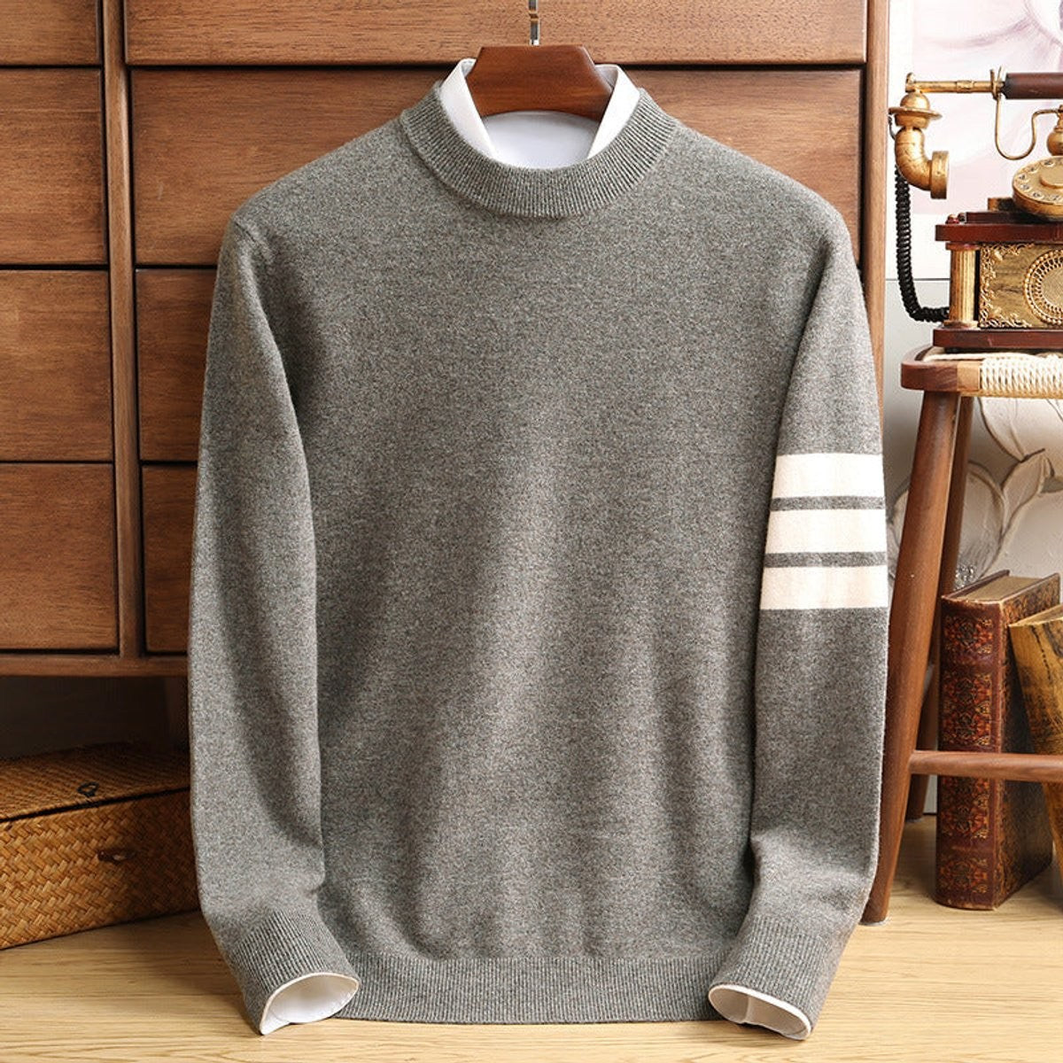 Grey lambswool jumper with mock-neck collar and contrast striped sleeve