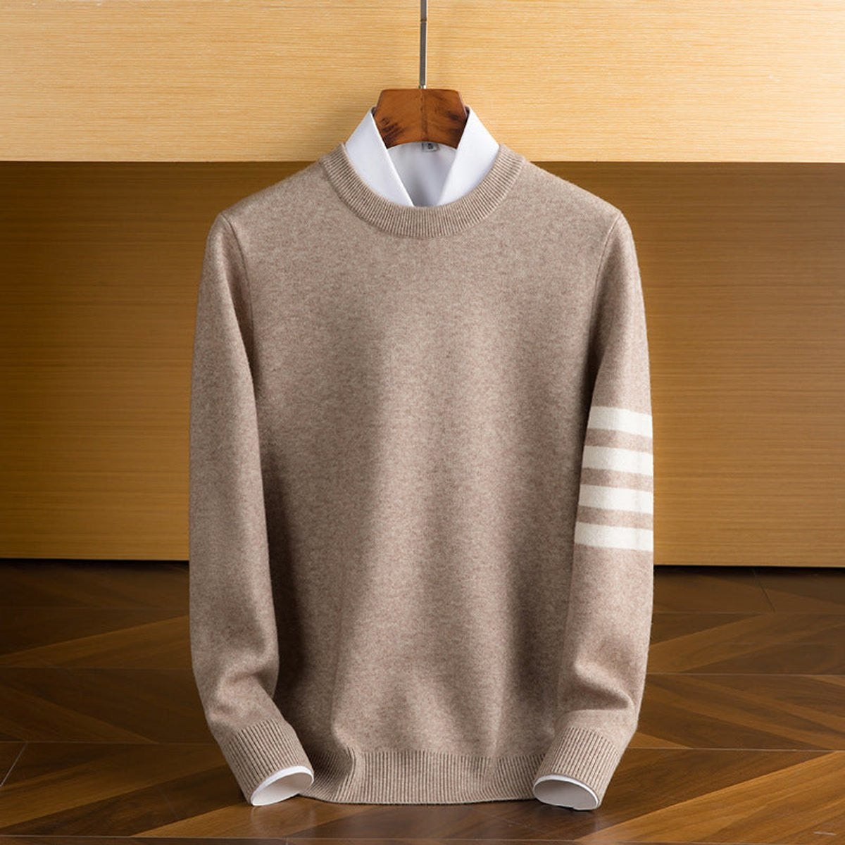 Beige lambswool pullover with white striped sleeve accent, crewneck style