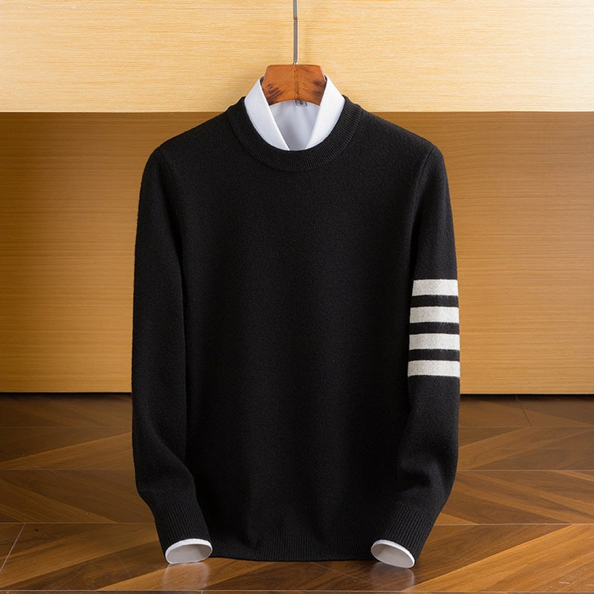 Black lambswool pullover with white striped sleeve detailing, crewneck cut