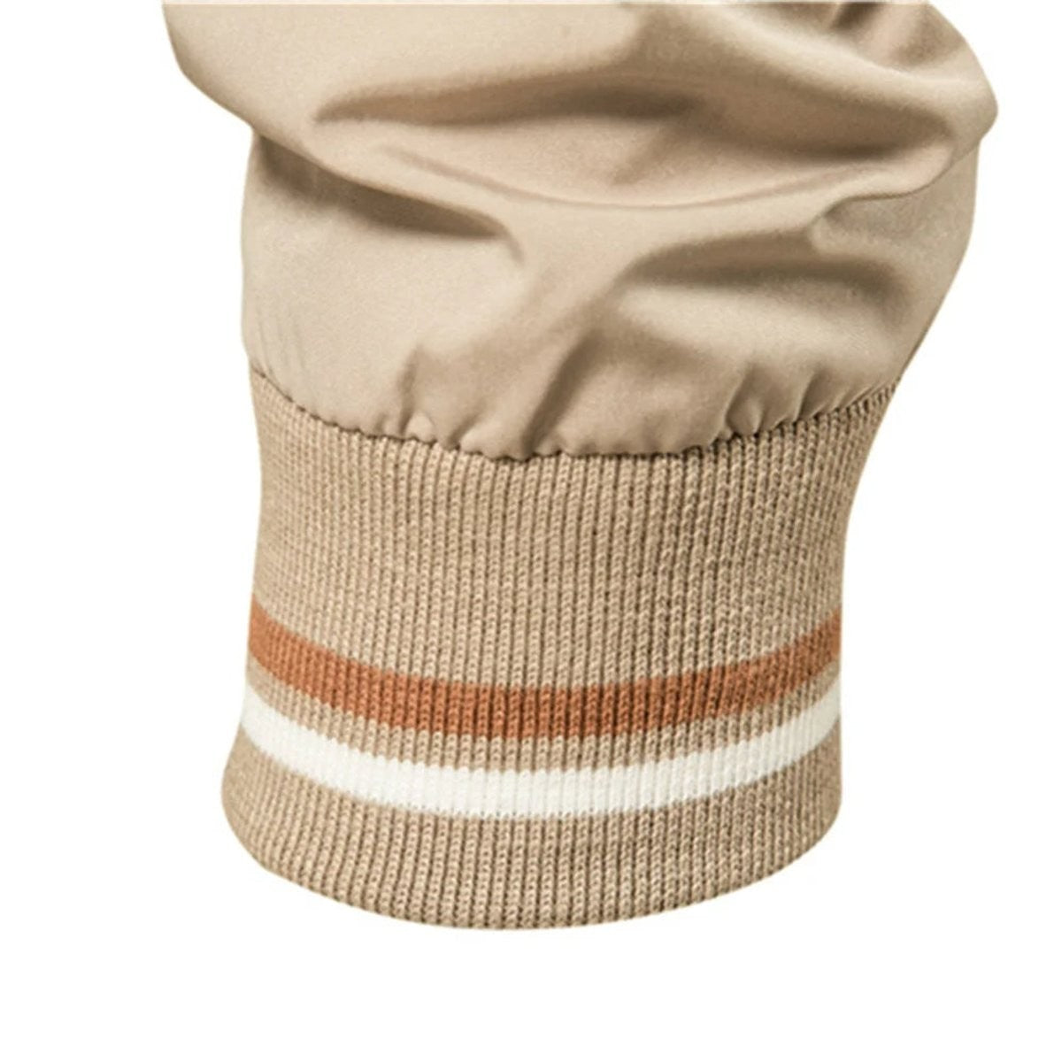 Ribbed cuff detail on beige bomber jacket with orange and white stripes