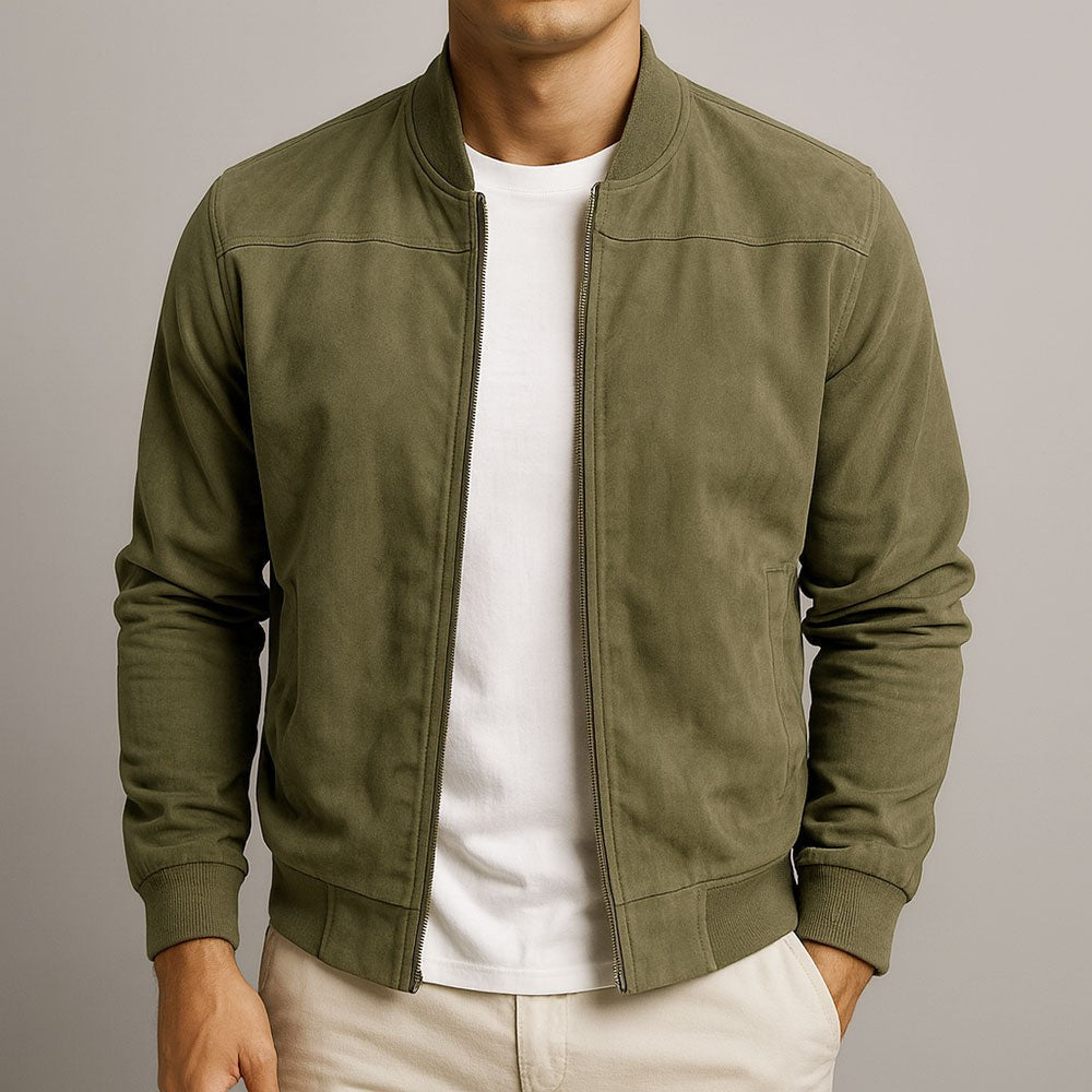 Olive green suede jacket styled with cream chinos
