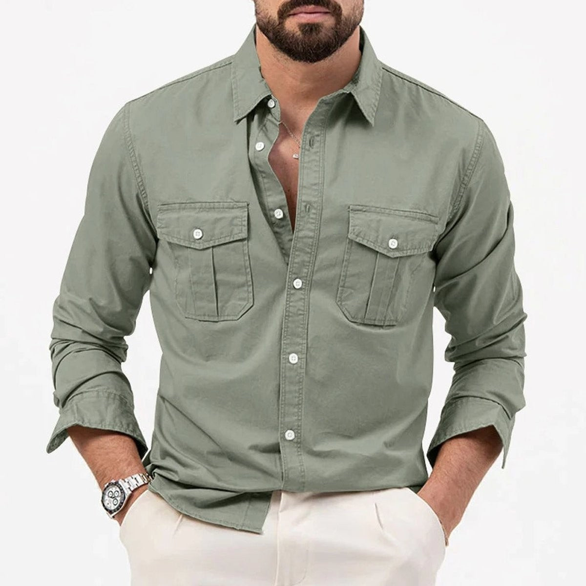 Close-up of olive green shirt with flap chest pockets and rolled cuff