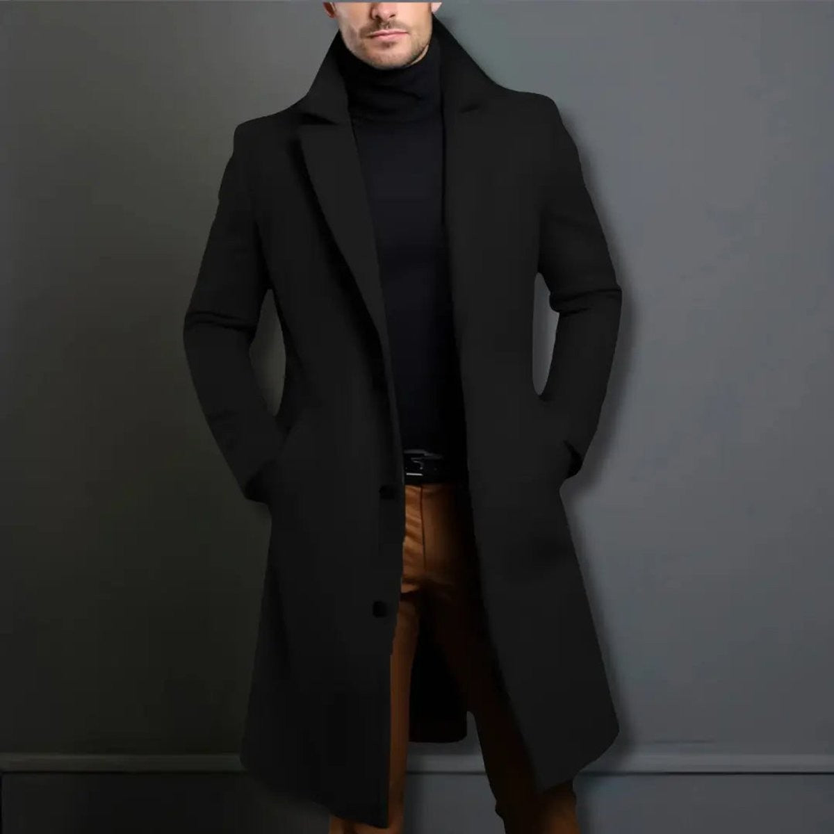 Black wool-blend trench coat styled with turtleneck and tan trousers