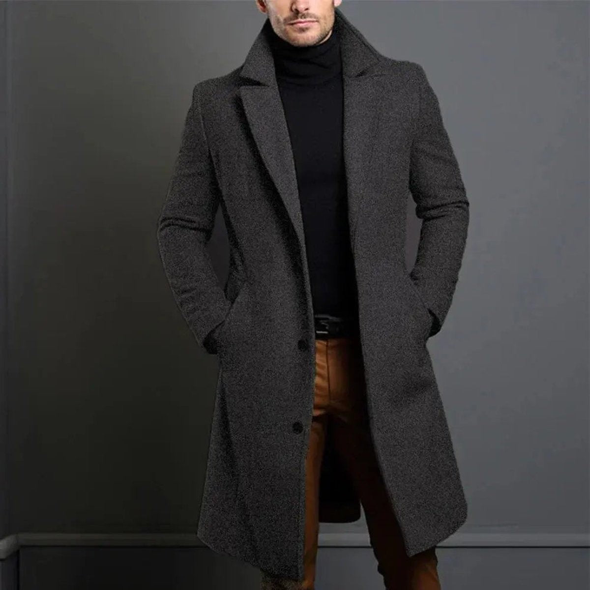 Charcoal grey long overcoat with tailored fit, worn over dark jumper