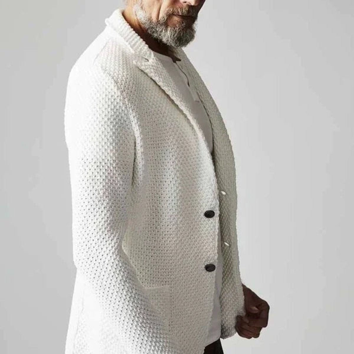 Side view of ivory knitted blazer jacket with button front and patch pockets