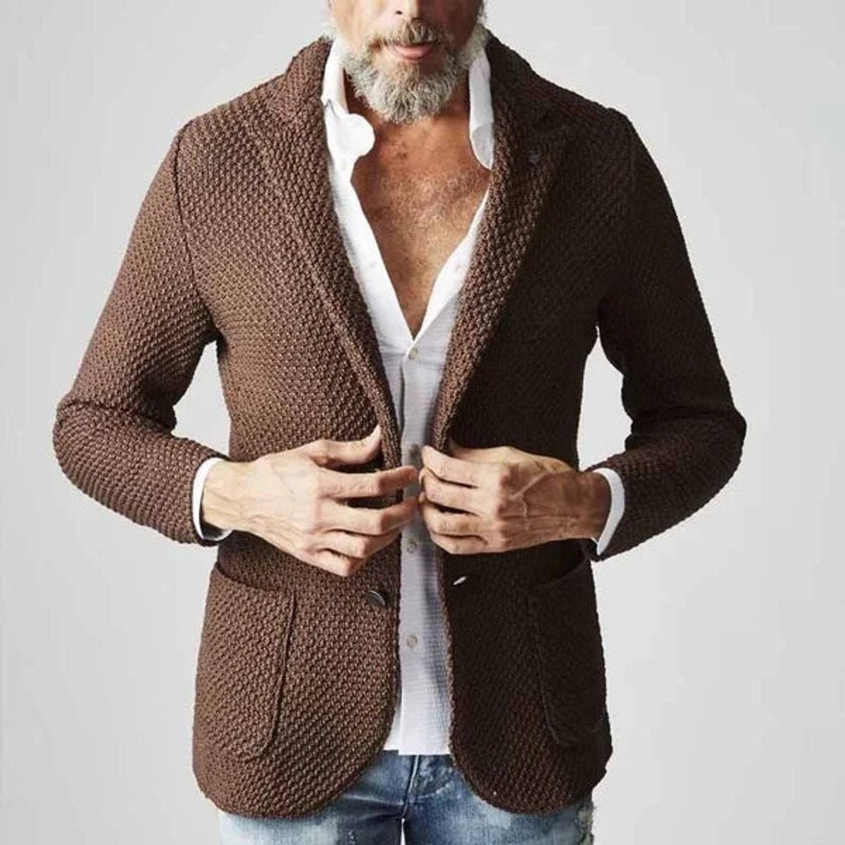 Brown knitted tailored blazer worn open over white shirt with patch pockets