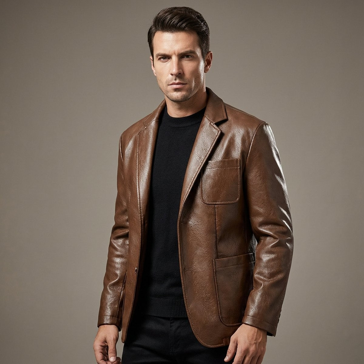 Man wearing brown vegan leather blazer with notch lapel over black jumper