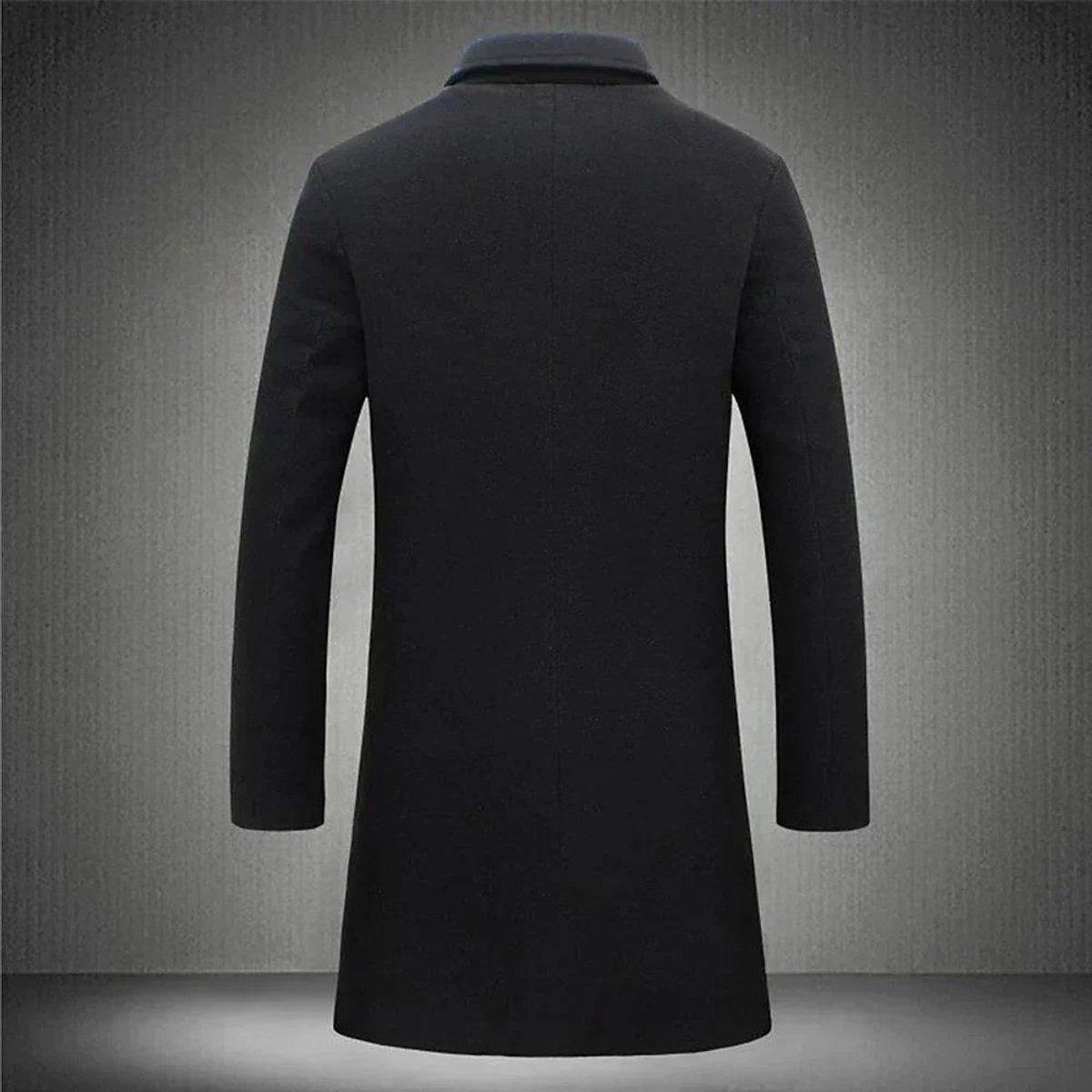 Rear view of black longline overcoat showing tailored fit and clean seaming