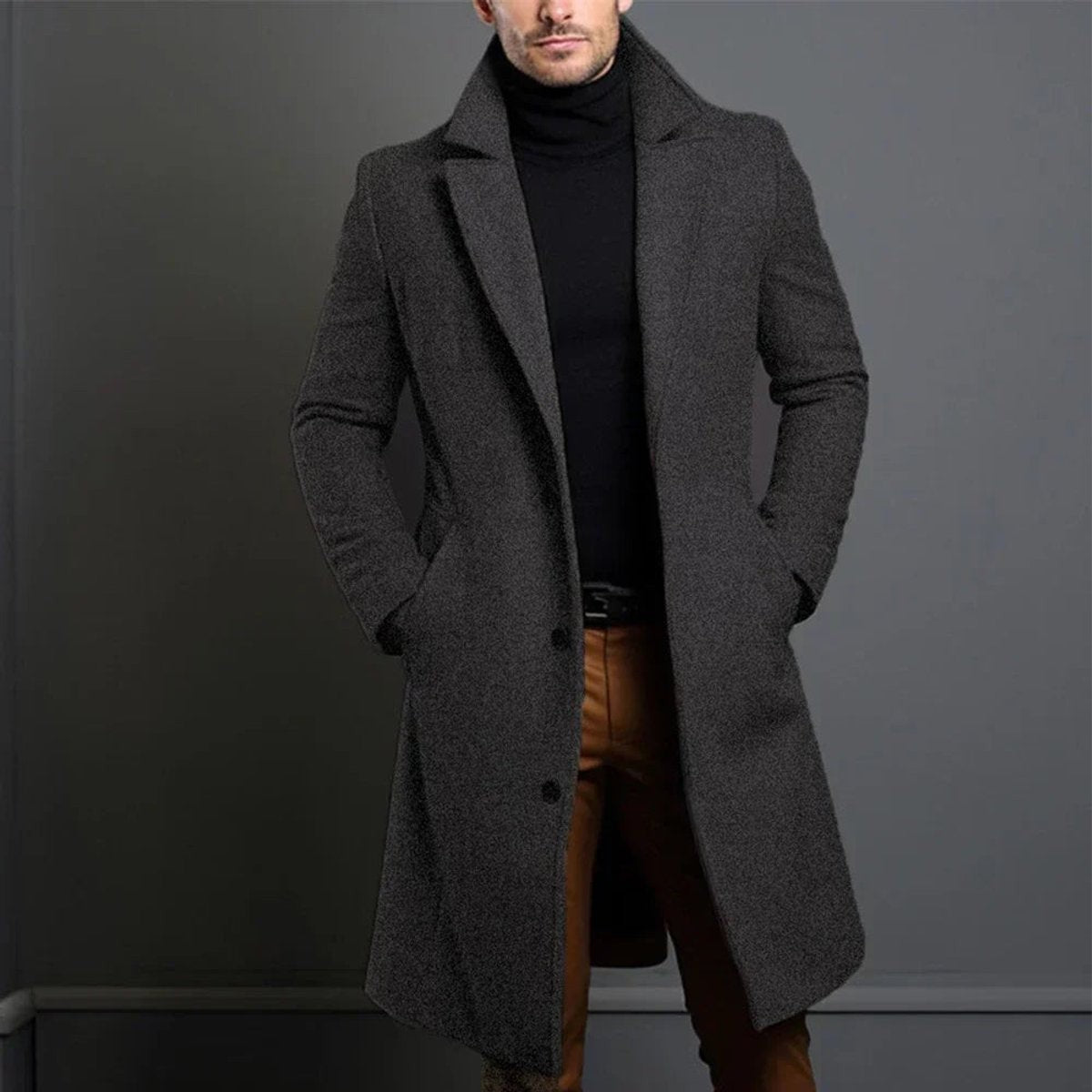 Charcoal grey longline overcoat with tailored slim fit worn over turtleneck