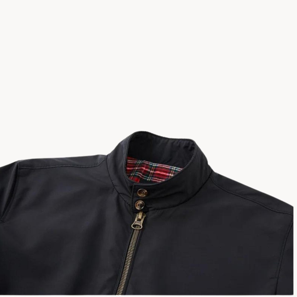Close-up of black Harrington jacket collar with tartan inner trim