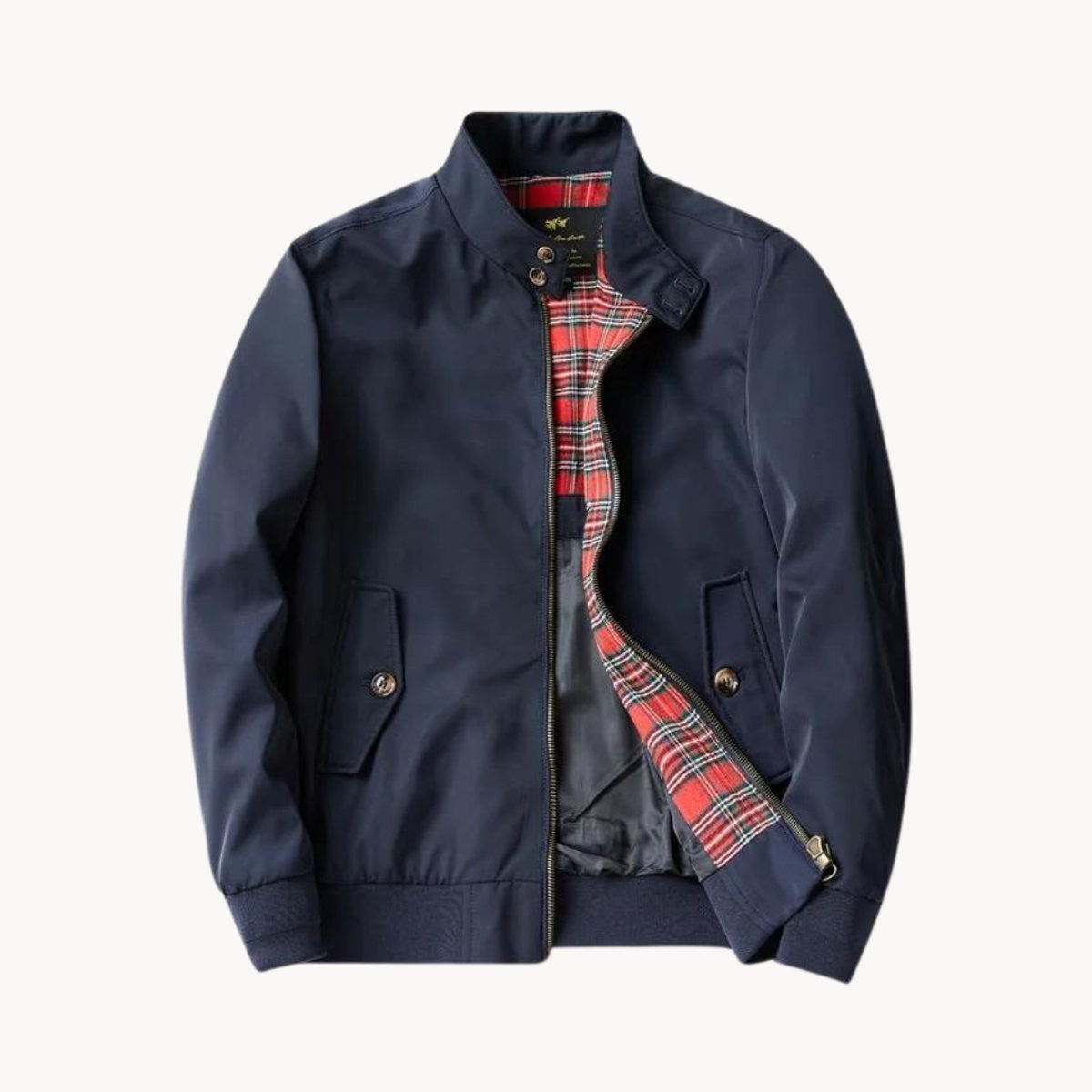 Navy Harrington bomber jacket showing zip-up front and tartan trim