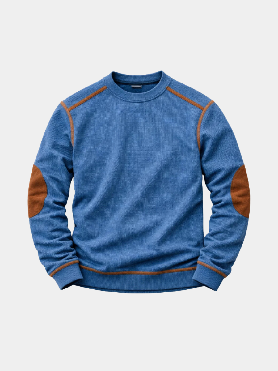 Blue textured crew-neck jumper with tan suede elbow patches and contrast stitching