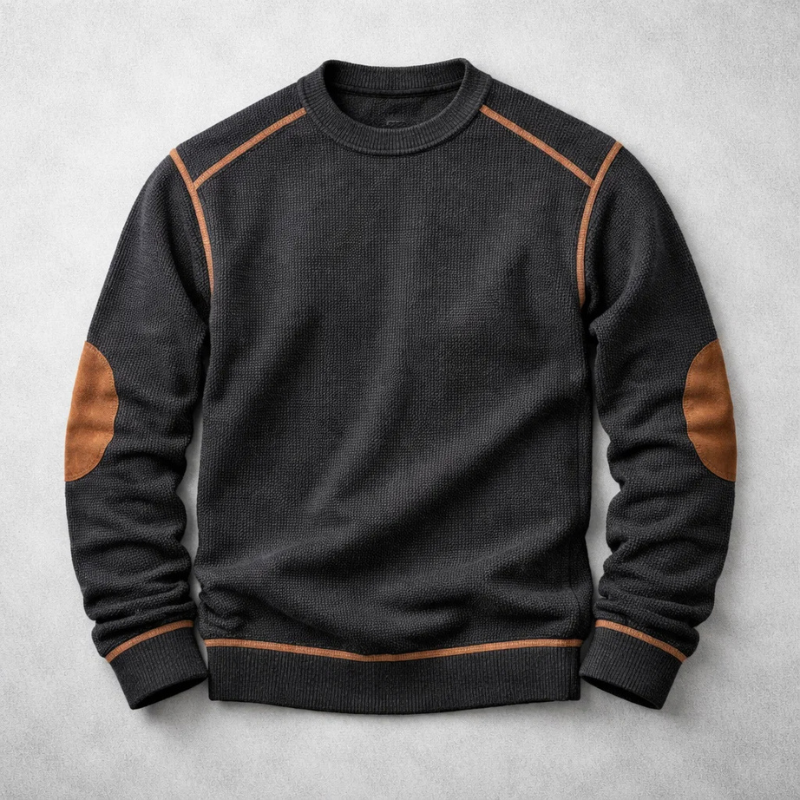 Black crew-neck jumper with tan suede elbow patches and ribbed cuffs