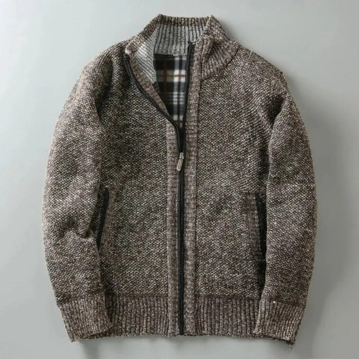 Brown marl knit zip-up bomber jacket with tartan lining laid flat