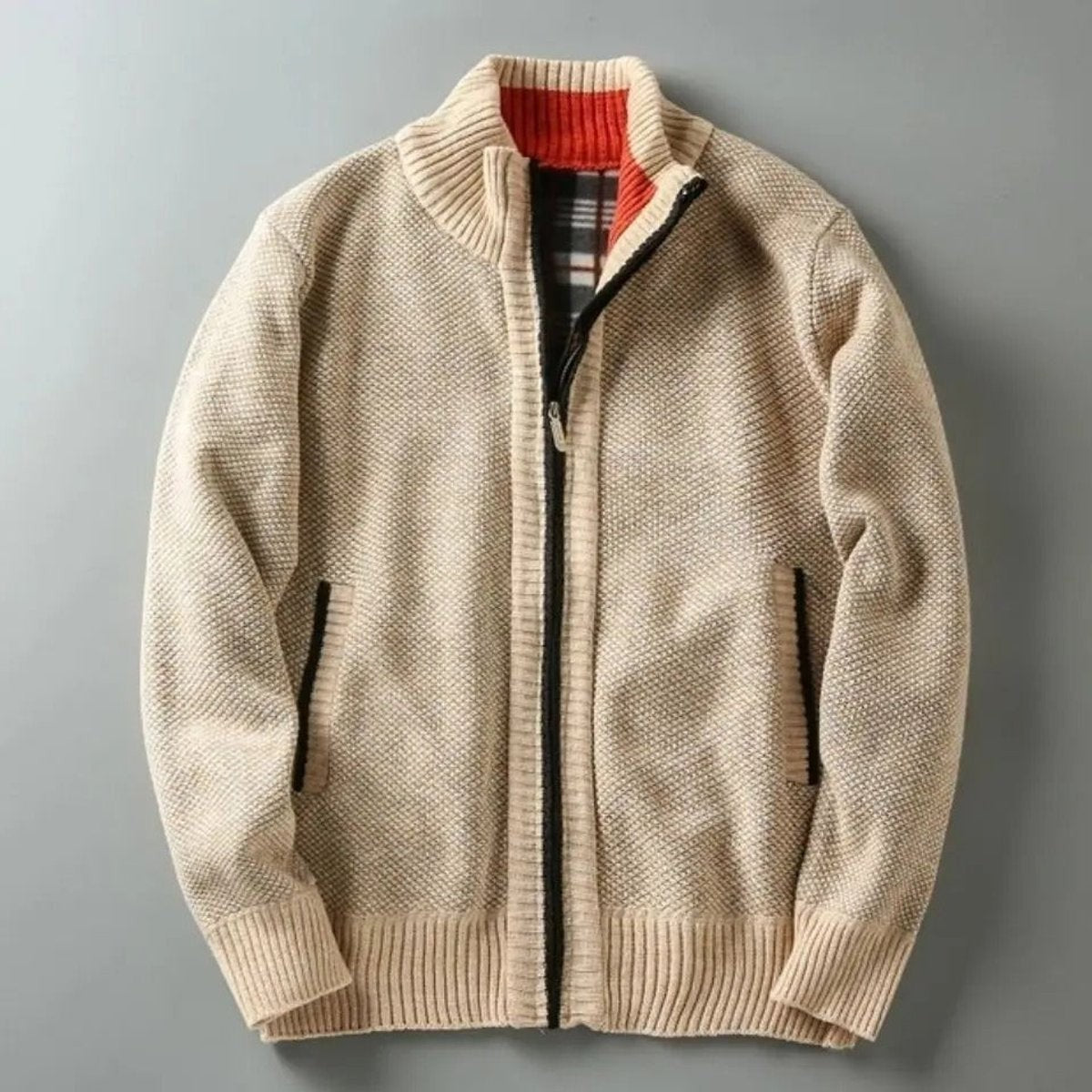 Rear view of cream knit zip-up jacket showing ribbed collar