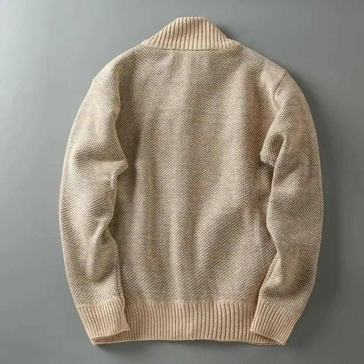Close-up of cream knit fabric and ribbed collar texture
