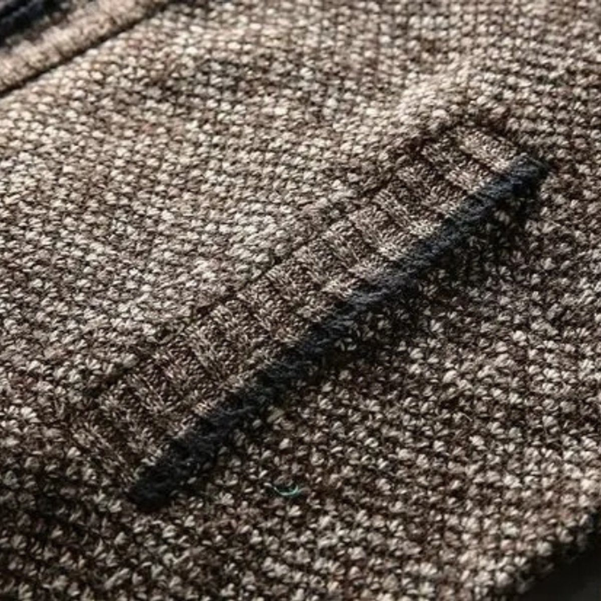 Close-up of chunky wool-blend knit pattern in brown tones