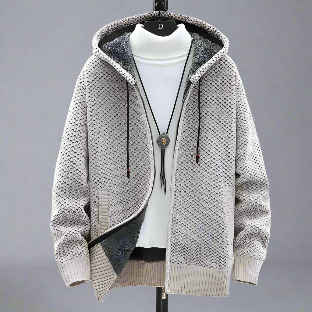 Textured grey knit hoodie showing fleece lining and ribbed cuffs