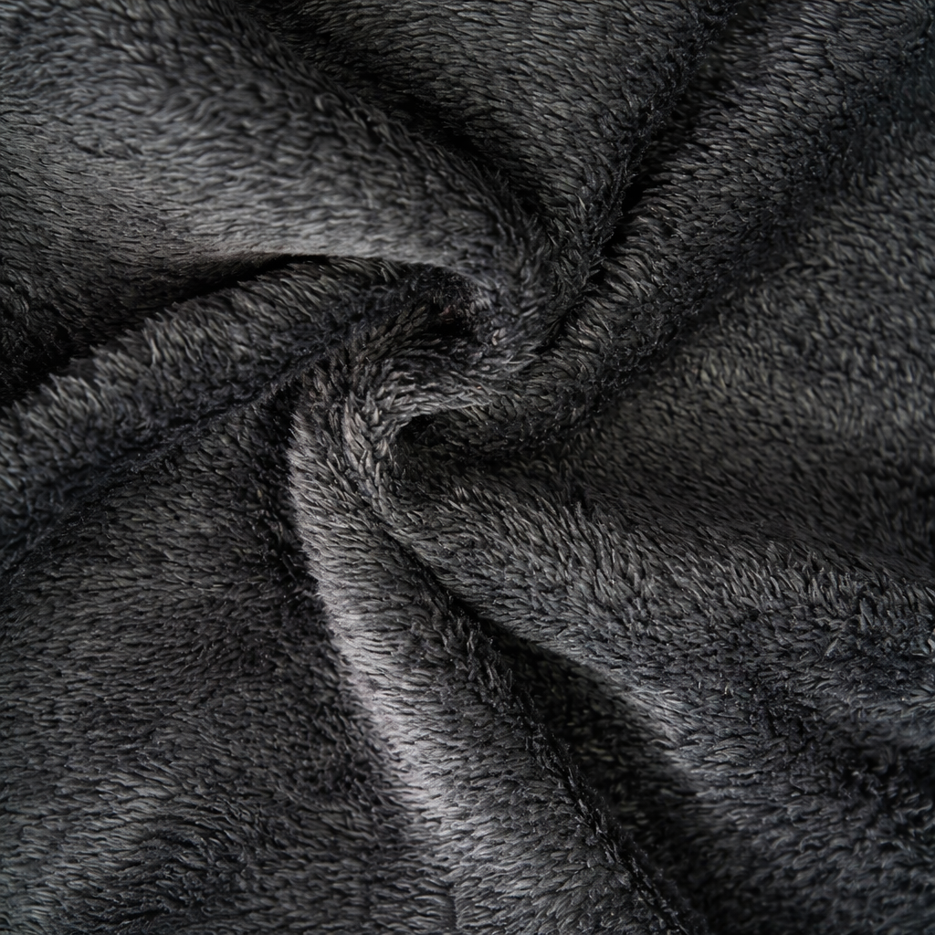 Close-up of dark grey fleece lining texture inside knitted hoodie