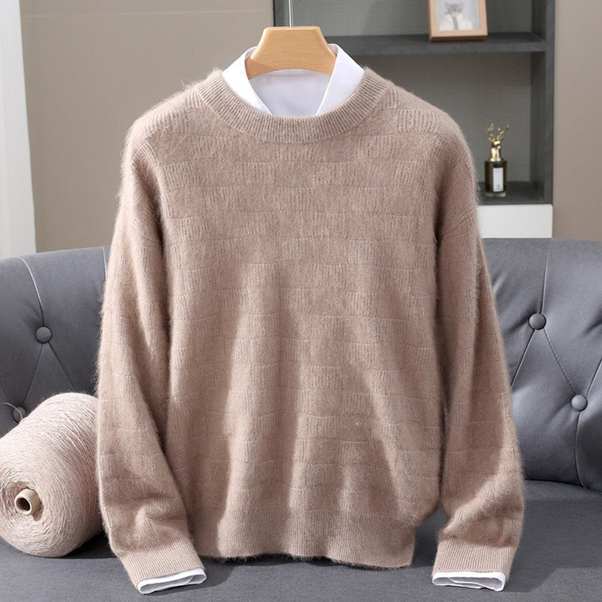 Beige knitted crew neck jumper with textured pattern, styled over white shirt