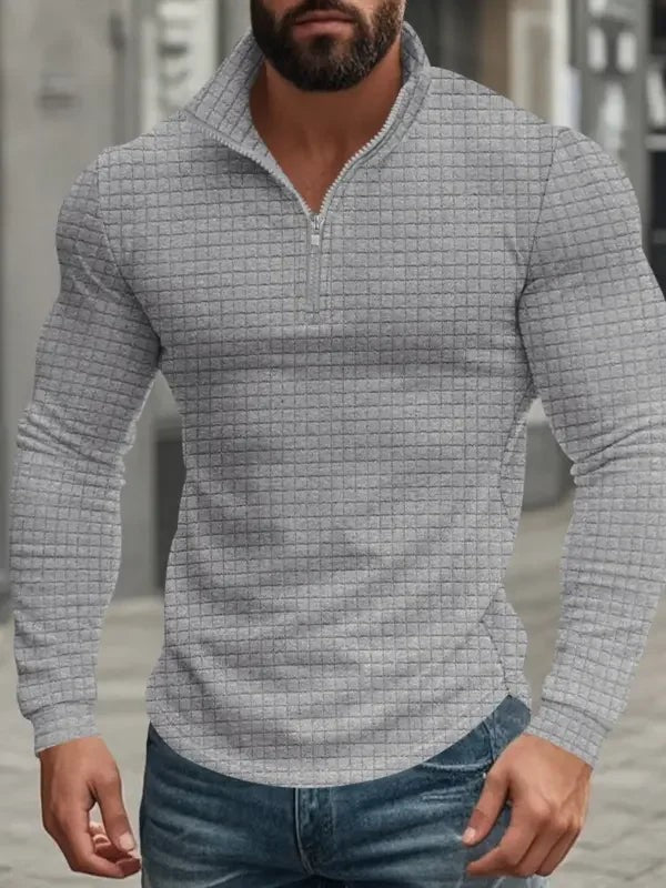 Light grey textured quarter-zip pullover with stand-up collar and long sleeves