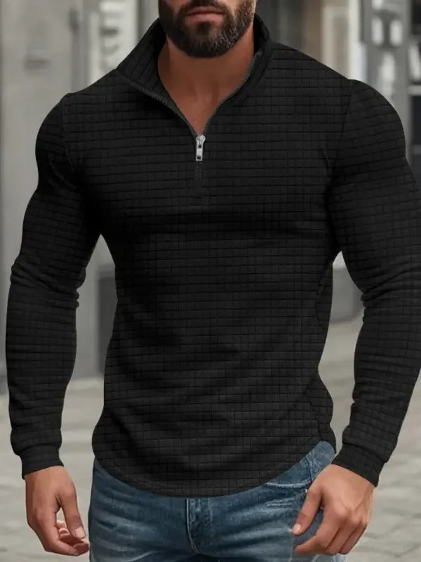 Black textured quarter-zip pullover with stand collar and curved hem