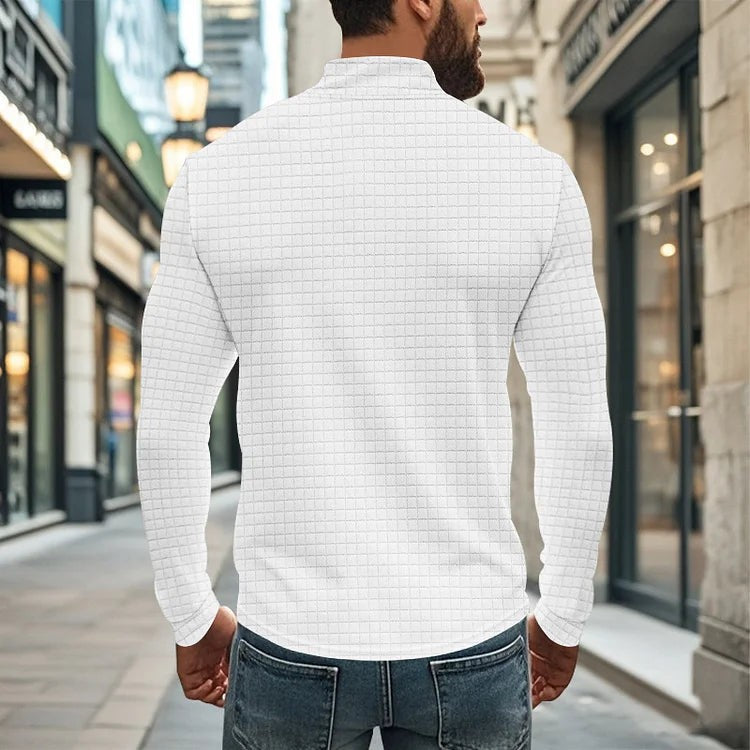 Rear view of white textured quarter-zip sweatshirt showing ribbed cuffs