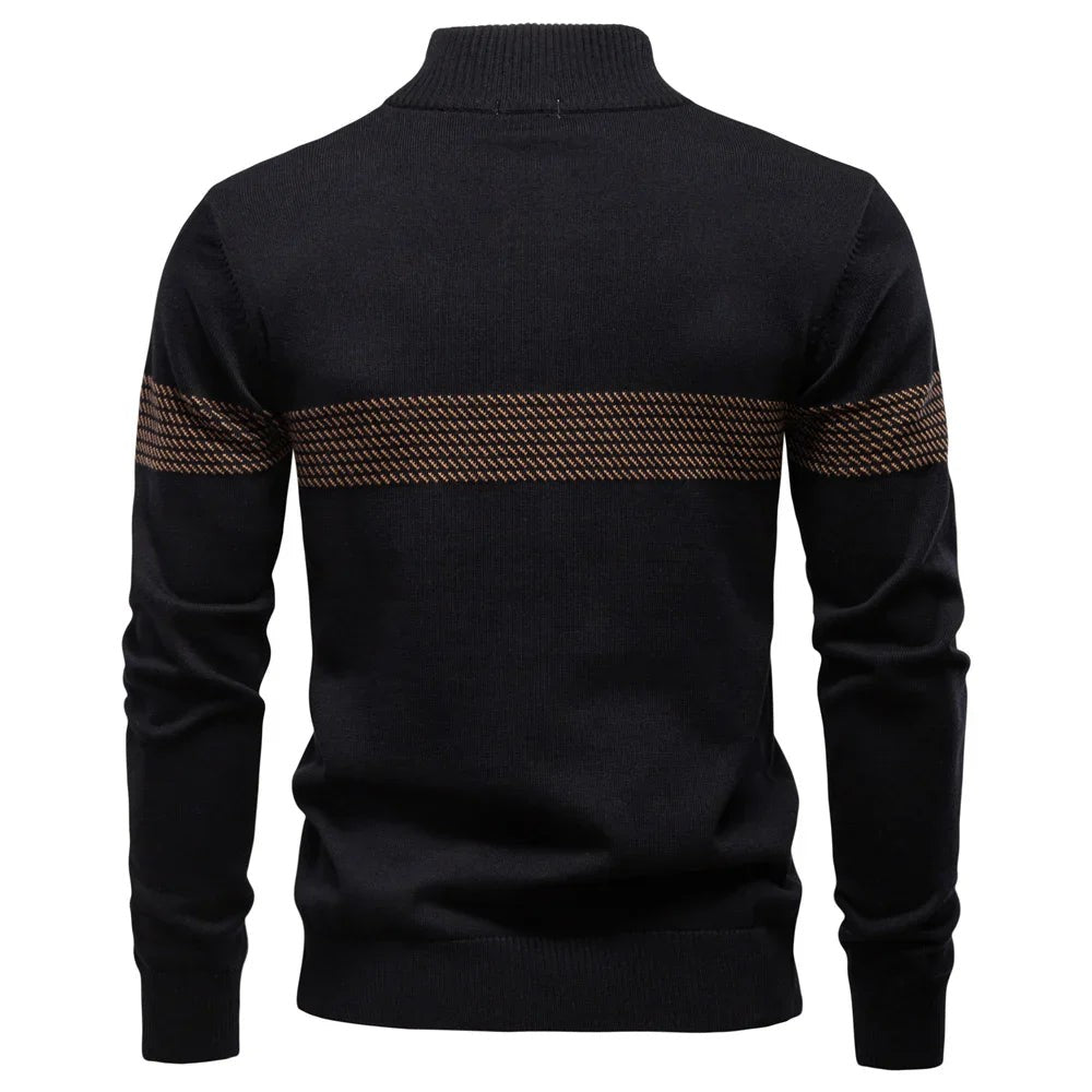 Rear view of black half-zip pullover showing striped panel across shoulders