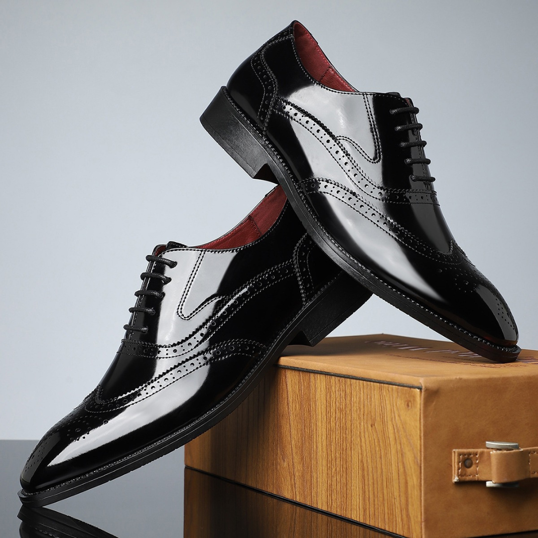 Glossy black patent leather brogues with classic wingtip stitching