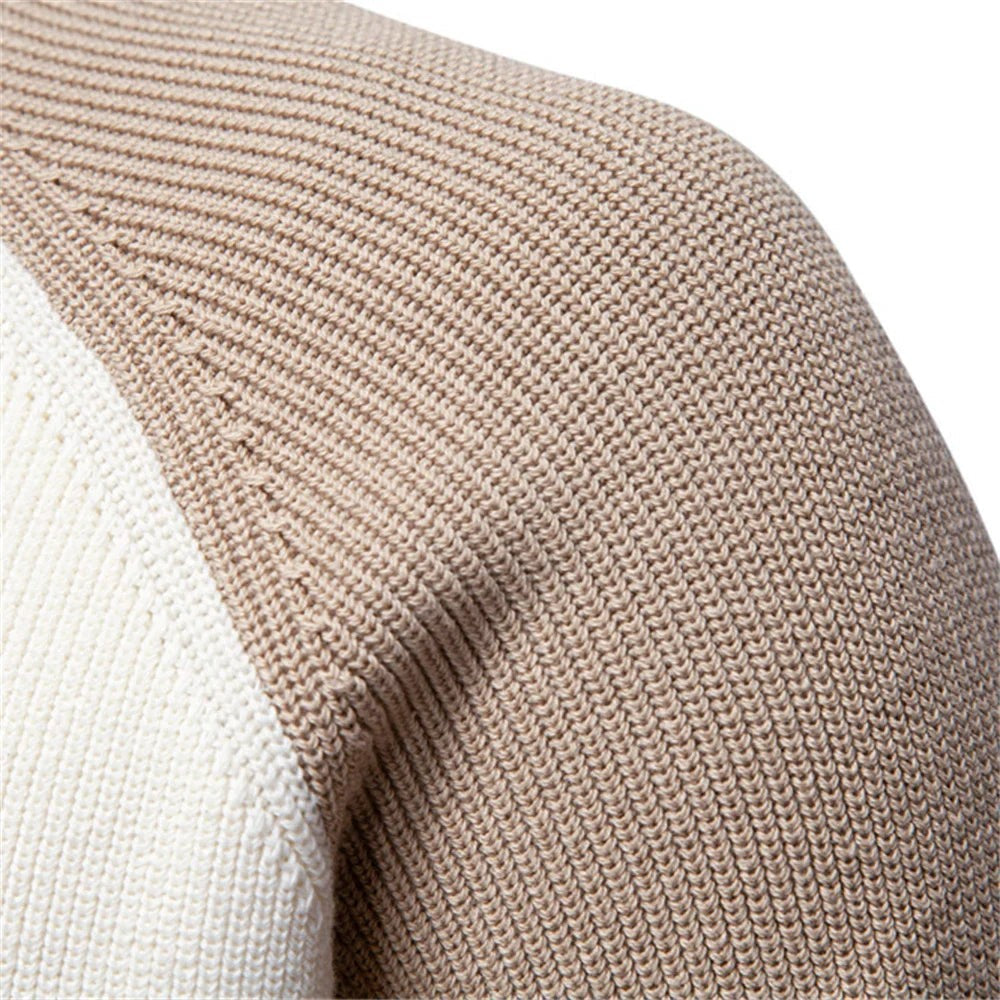 Close-up of beige and cream knit seam showing raglan sleeve stitching