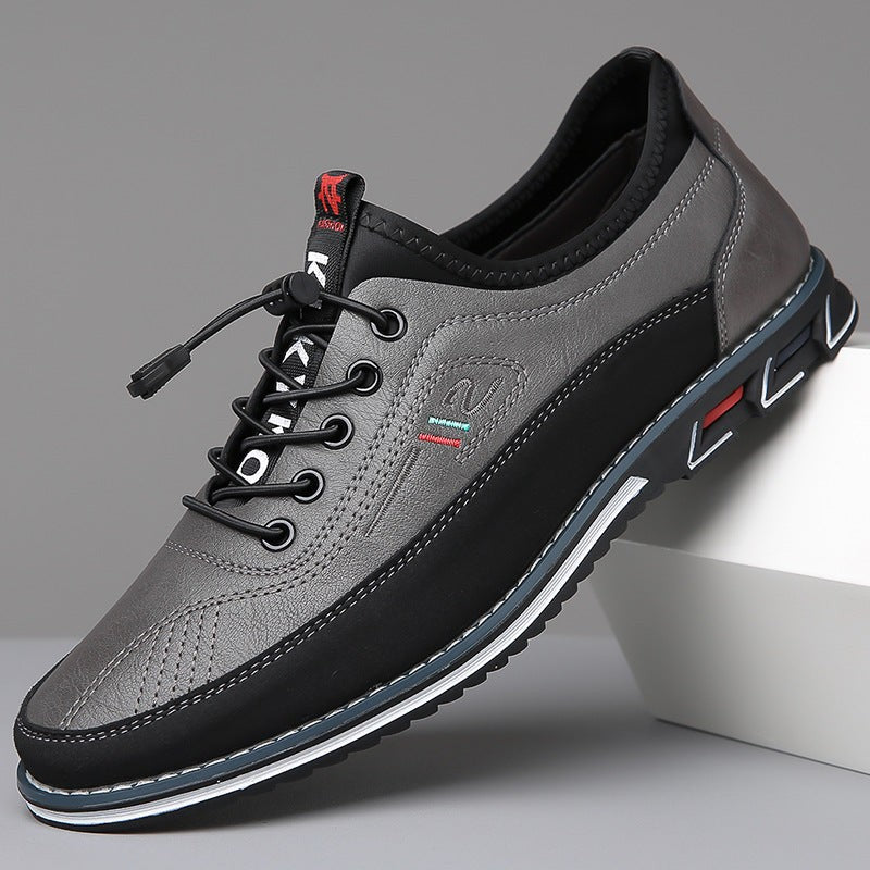 Grey leather men's casual shoe with black trim and toggle laces