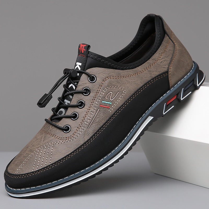 Taupe leather trainer with black accents and chunky tread sole