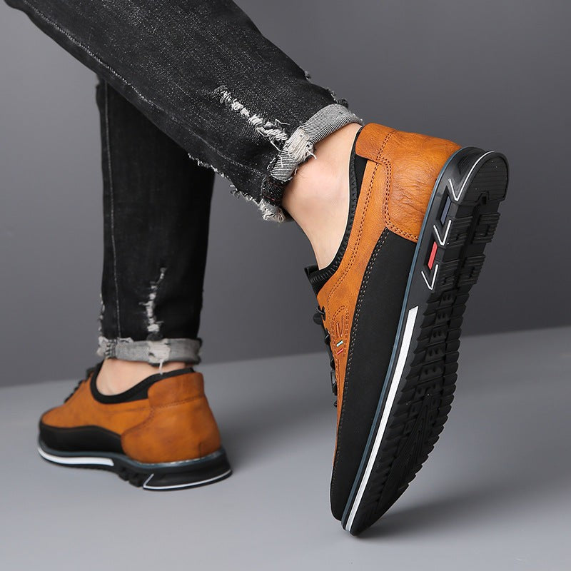 Model wearing tan and black leather casual shoe with ripped jeans