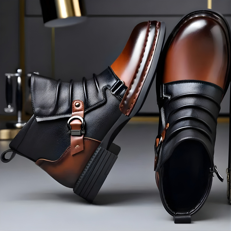 Man wearing brown leather ankle boots with buckle strap and zip