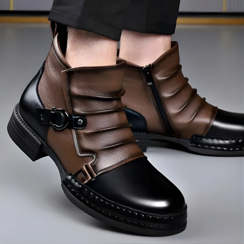 Man modelling black and brown leather boots with buckle detail