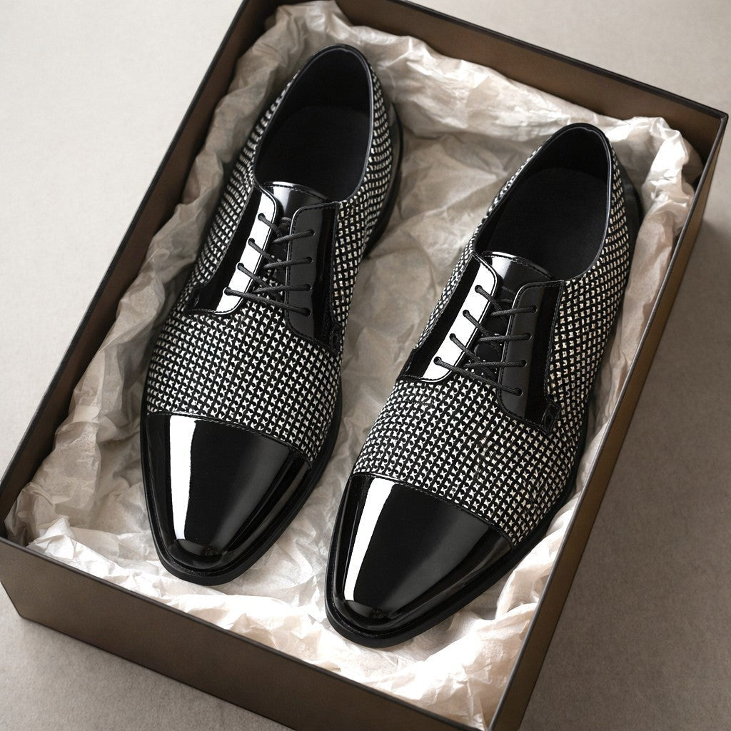 Black and white textured Oxford shoes with patent cap toe in a gift box