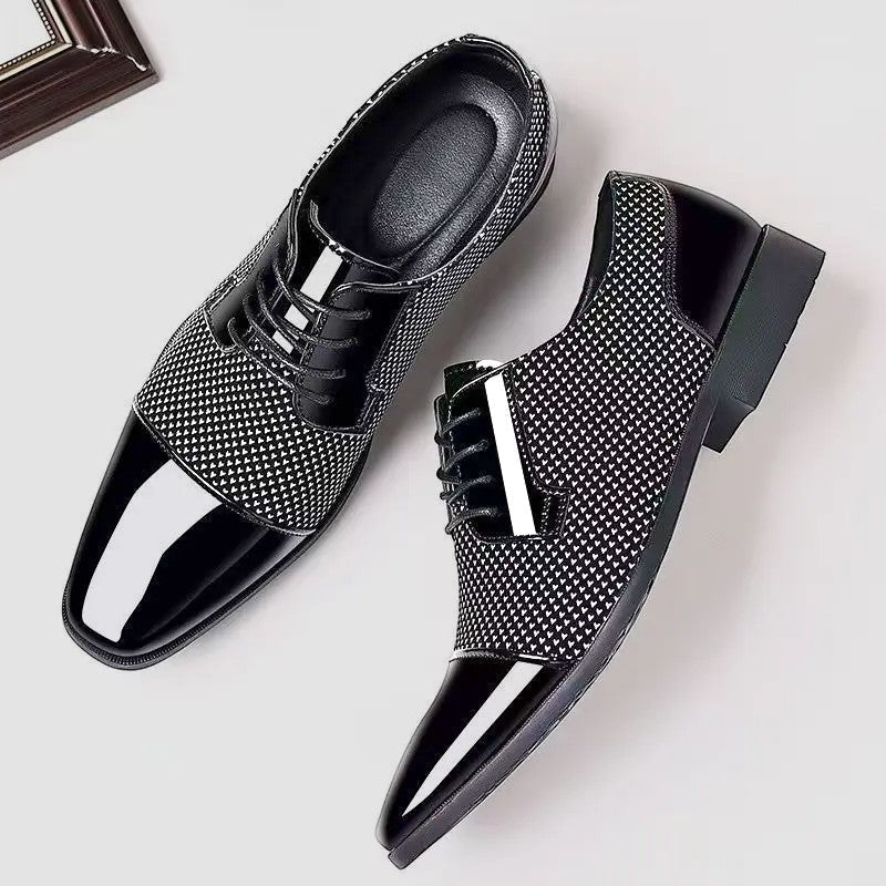 Black and white textured Oxford shoes with patent cap toe laid flat