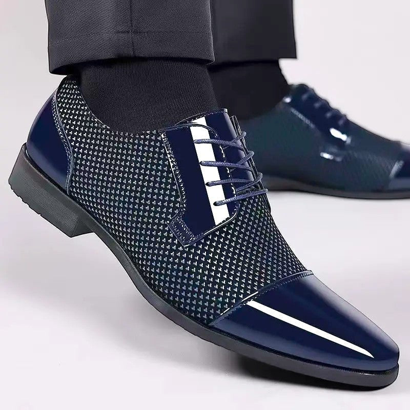 Men's navy patent Oxford shoes styled with dark tailored trousers