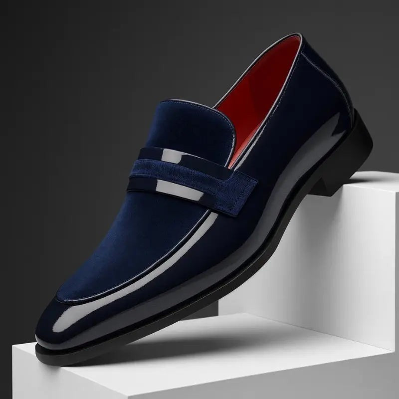 Navy patent and suede penny loafer with pointed toe and glossy trim