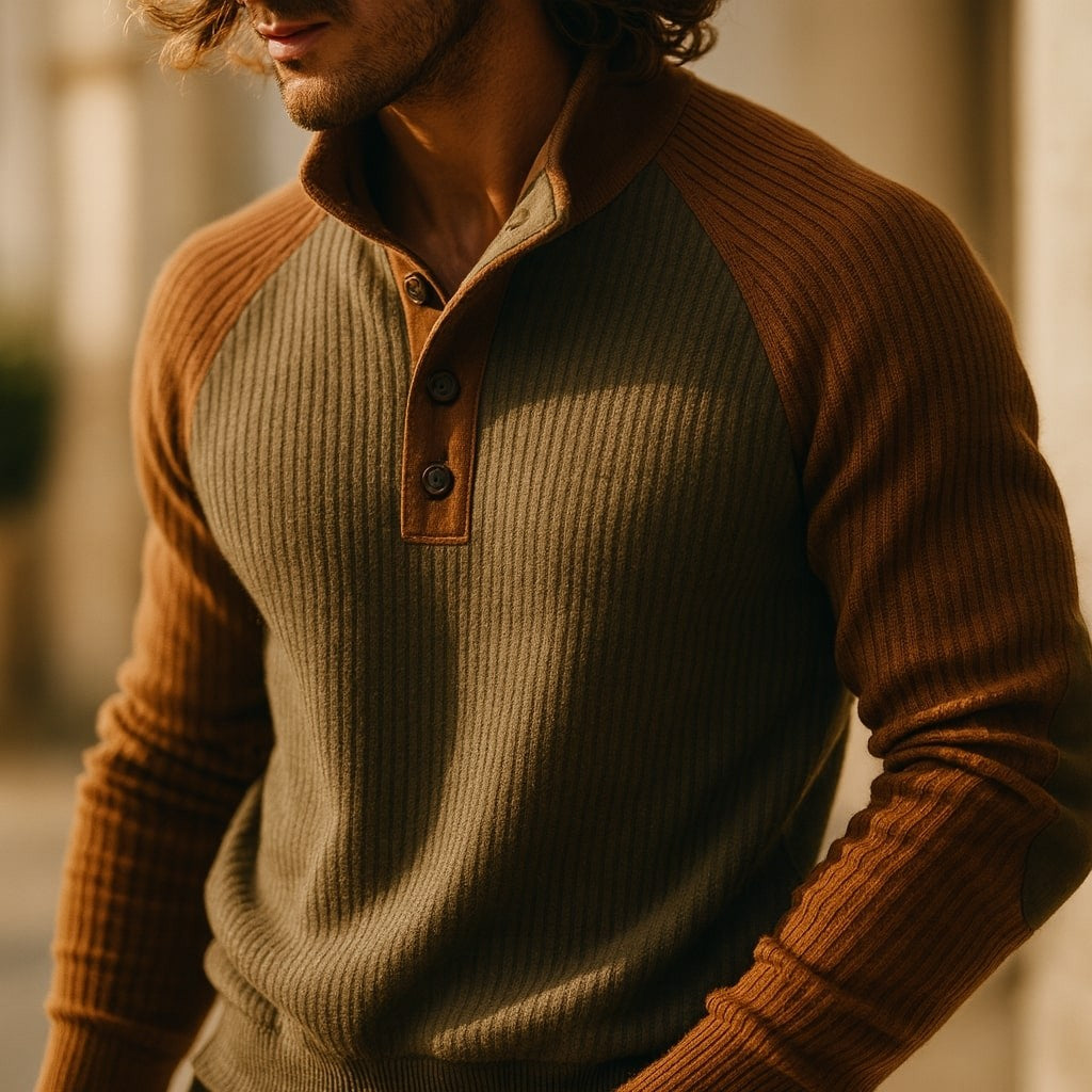 Close-up of olive and rust cable knit jumper showing button collar detail