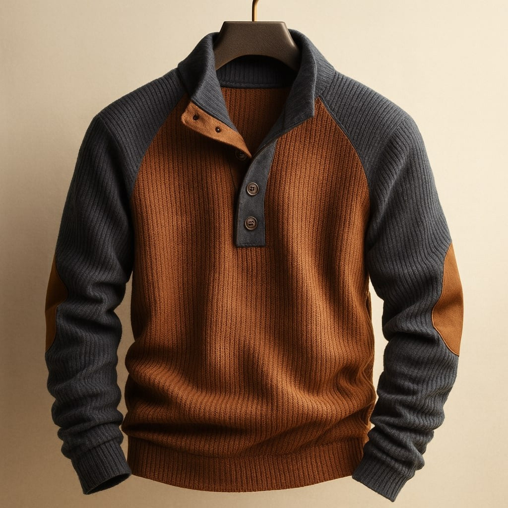 Rust and charcoal cable knit jumper featuring suede elbow patches