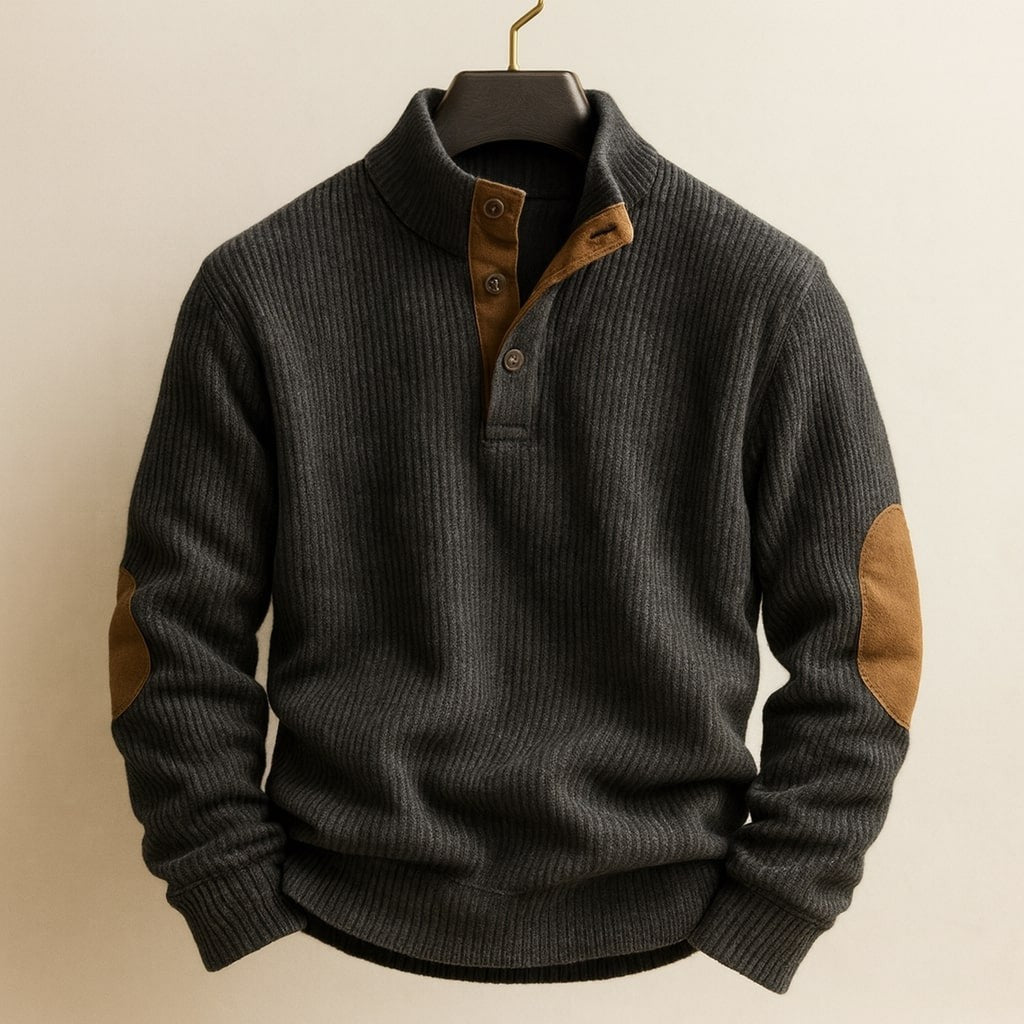 Charcoal grey cable knit jumper with tan button placket and elbow patches