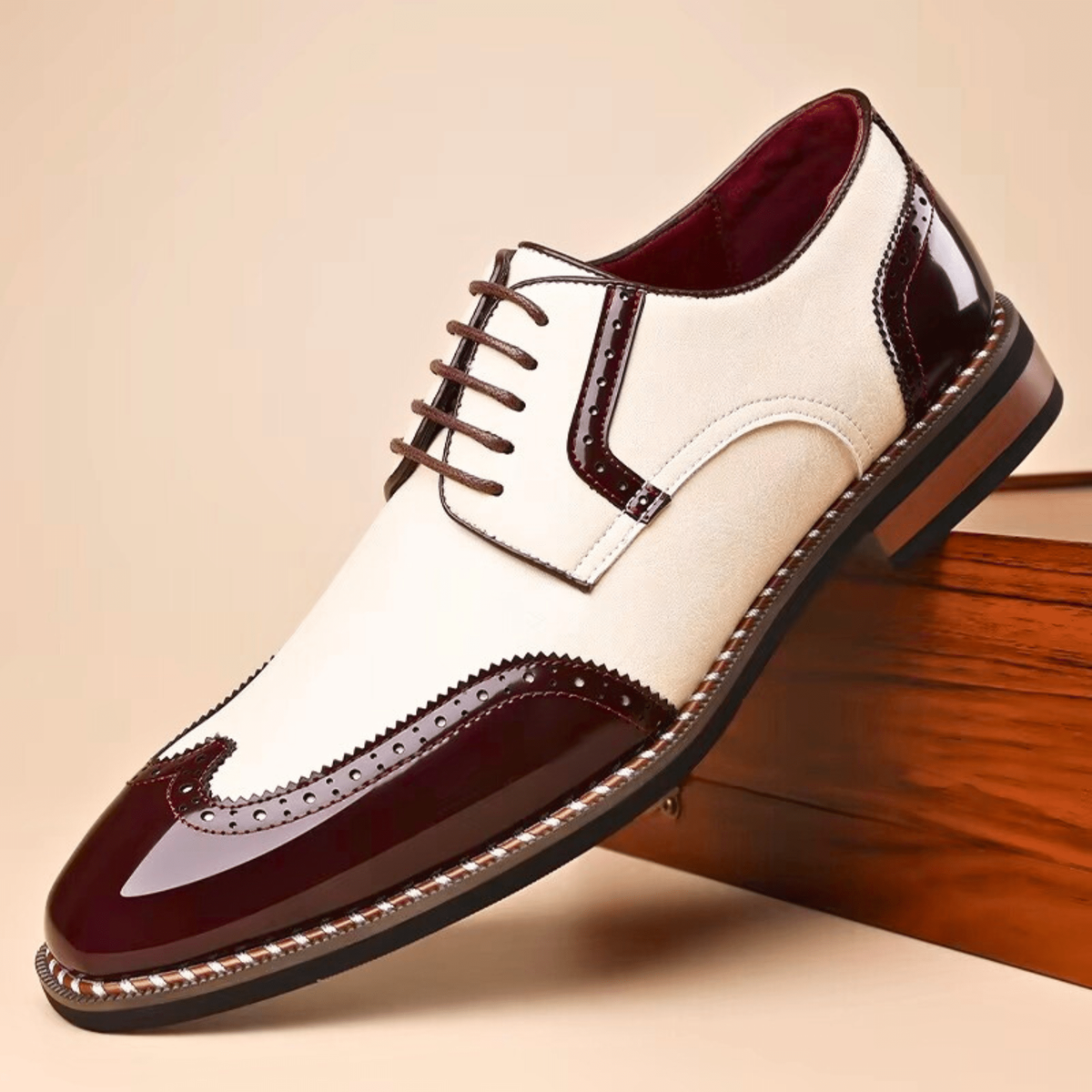 Two-tone brogue Oxford shoe with cream suede and burgundy patent leather panels