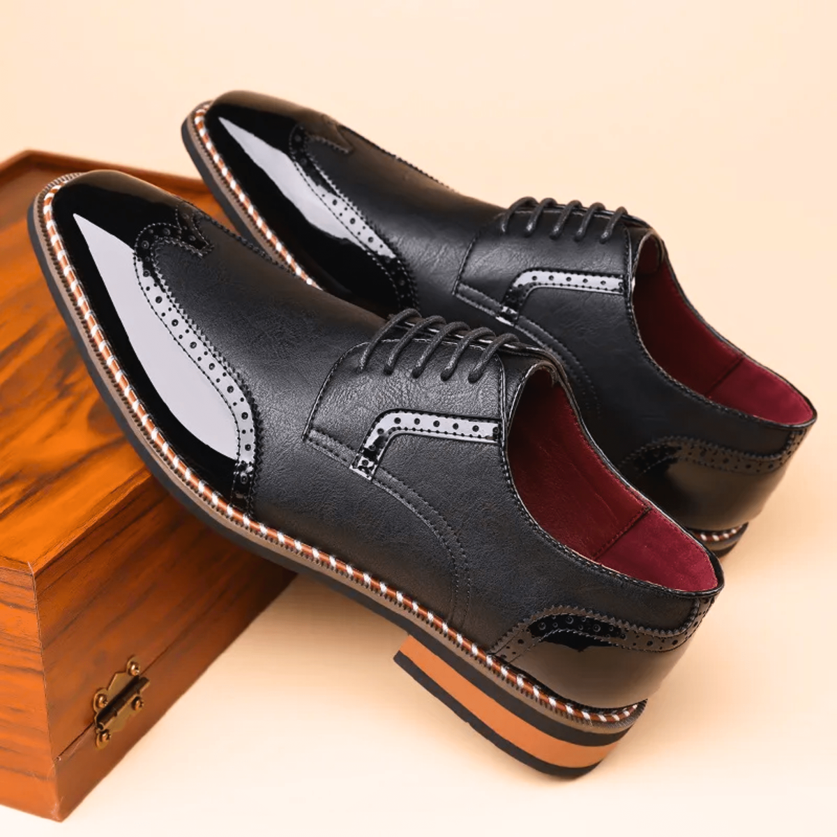Pair of black two-tone brogue Oxford shoes with patent toe caps