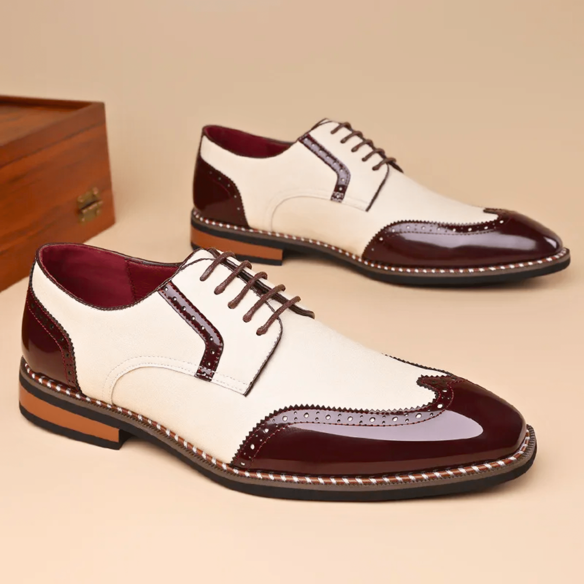 Cream and burgundy leather brogue Oxford shoes shown side by side