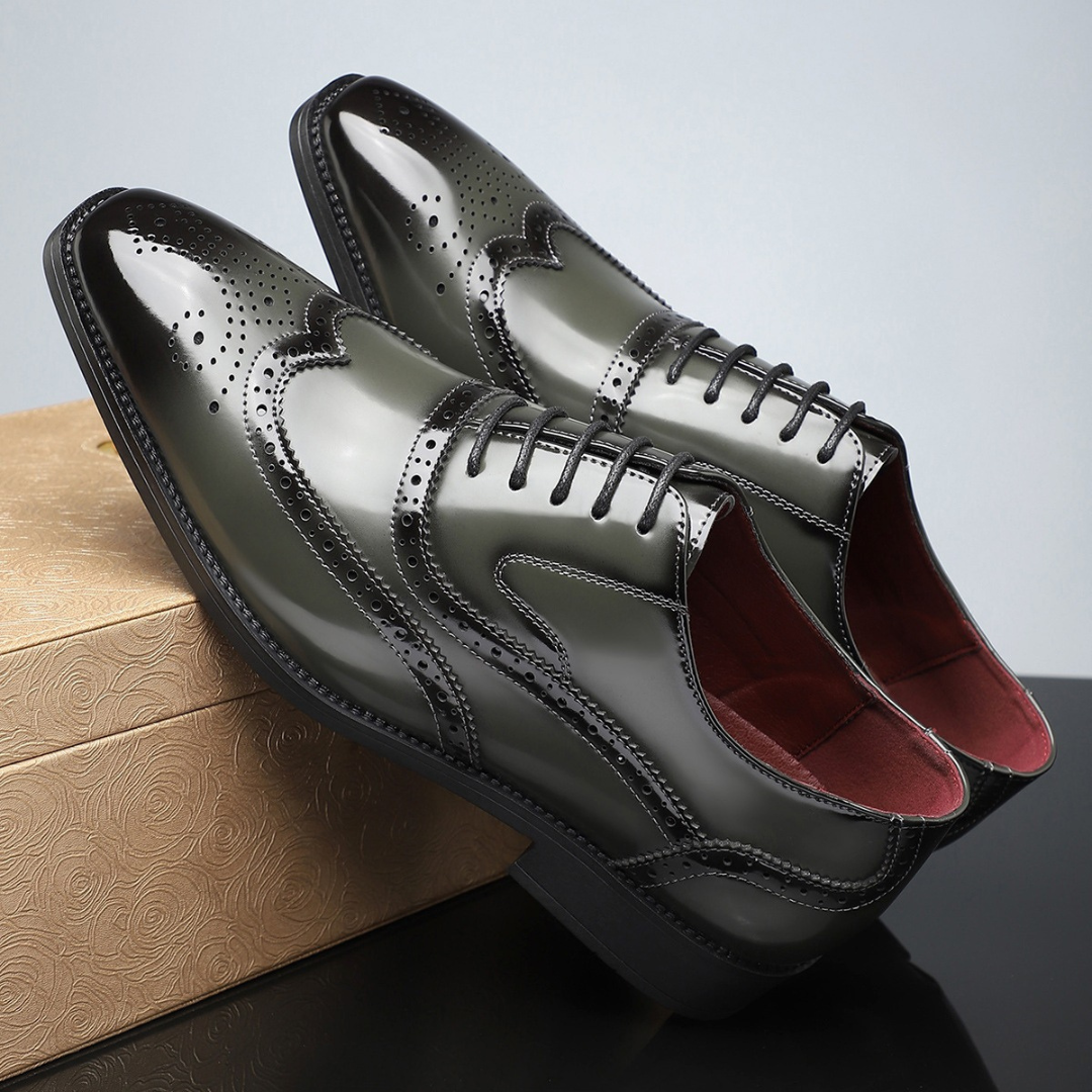 Olive green patent leather wingtip brogues with perforated detailing