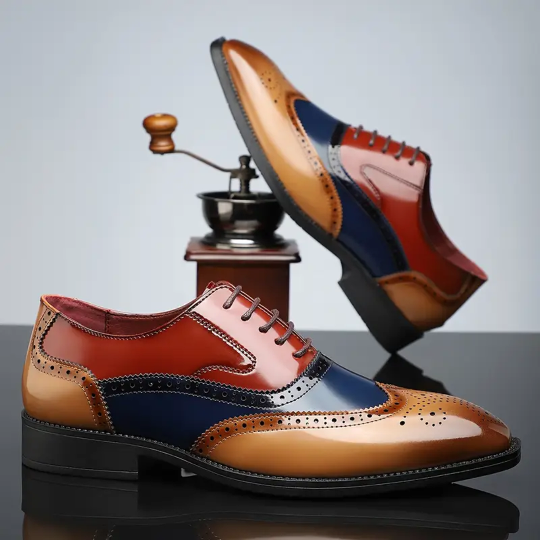 Tan, navy and red leather brogues displayed beside a coffee grinder